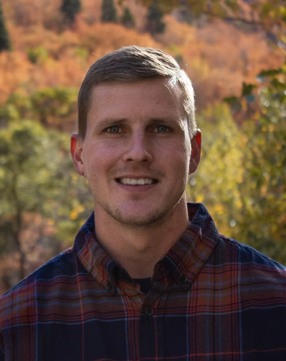 Zach Morrison, owner of Snow Top Electric, standing outside a Utah home